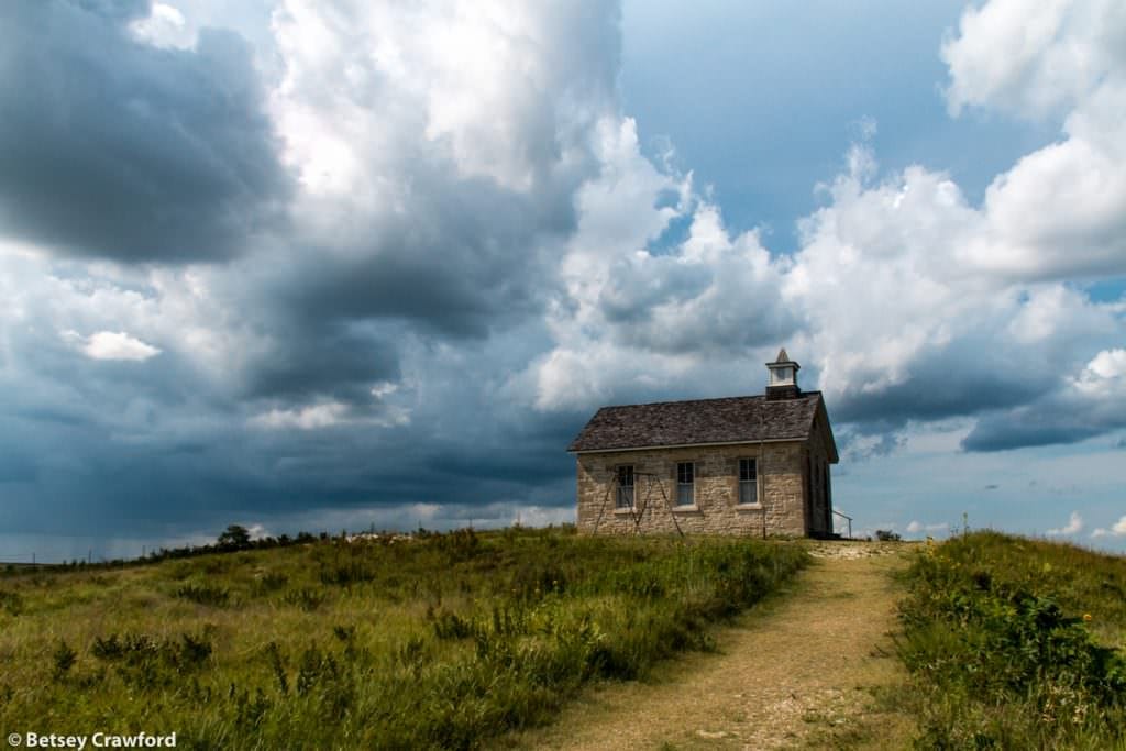An old schoolhouse, one of many striking landscapes in the Tallgrass National Preserve in the Flint Hills, Kansas by Betsey Crawford