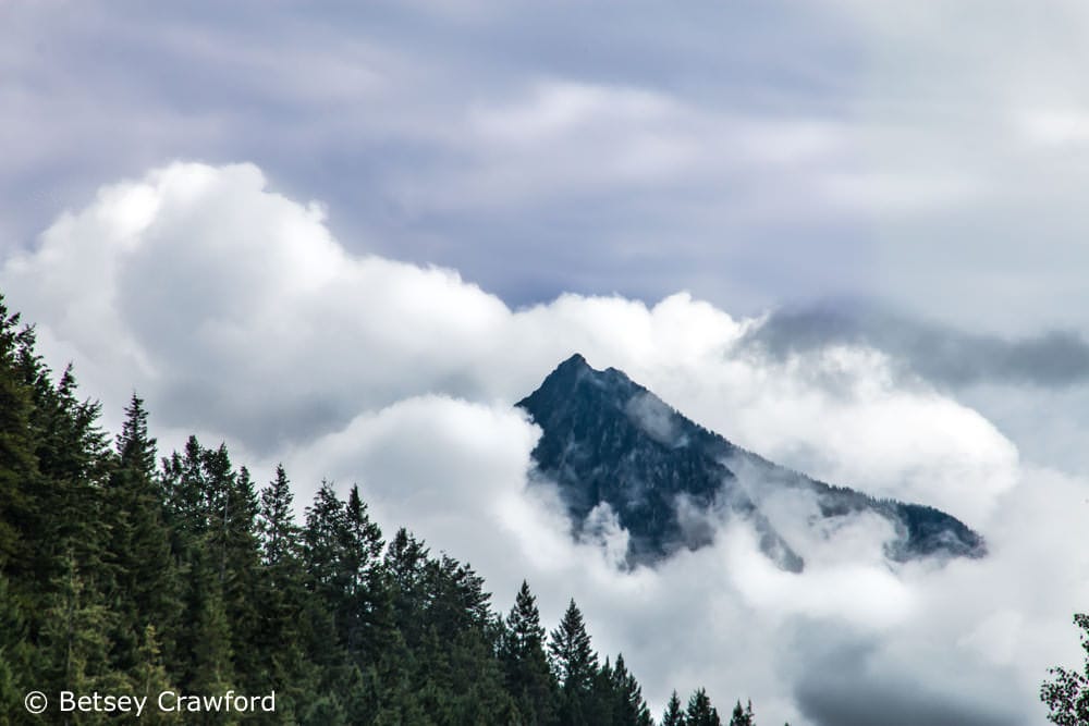 Mountain top in the clouds in Golden, British Columbia by Betsey Crawford