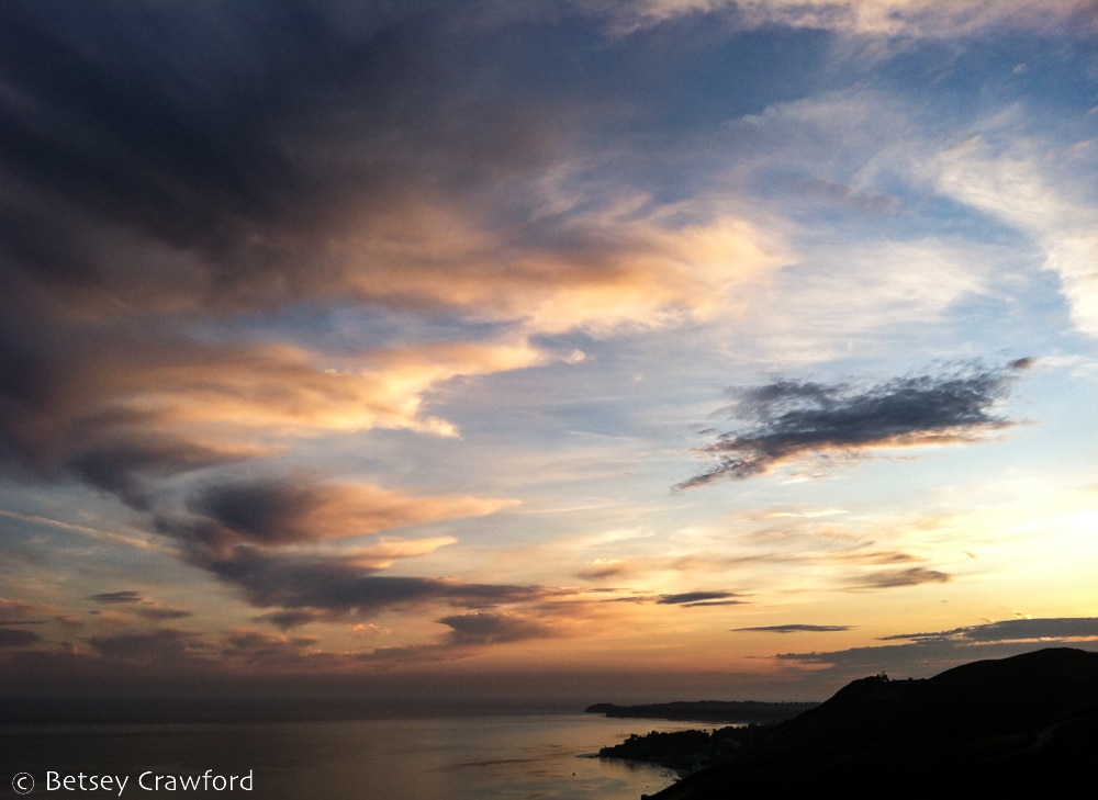 Dark and light sunset over the Pacific Ocean in Malibu, California by Betsey Crawford